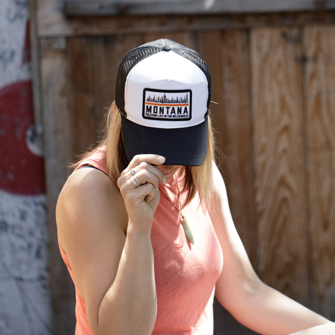 FREEDOM LIES IN THE WILDERNESS BLACK AND WHITE TRUCKER HAT
